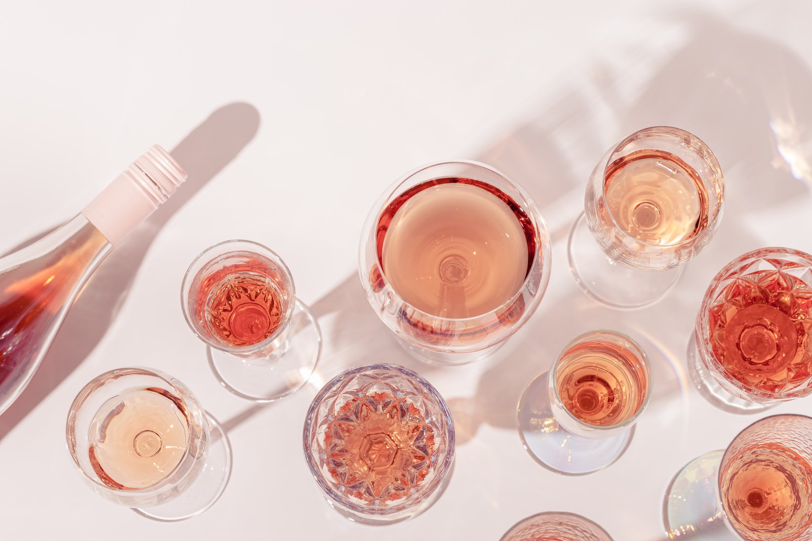 Many Glasses of Rose Wine and Bottle Sparkling Pink Wine Top Vie