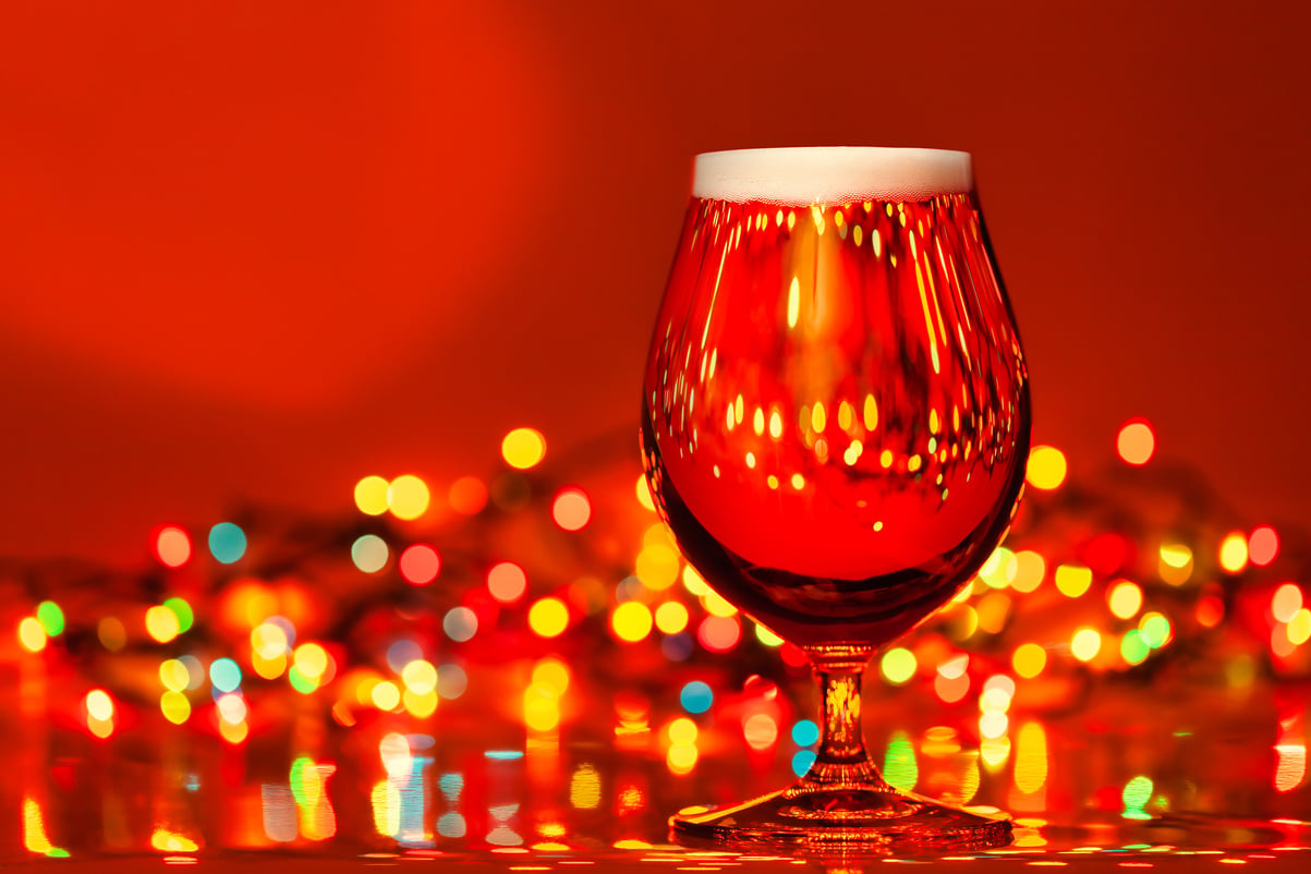 Tulip glass of beer with christmas lights